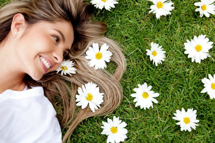 Woman in a garden of flowers